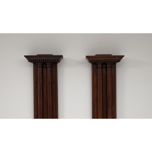 A pair of 19th Century French wooden columns showcasing rich original patina and beautifully aged character. Each column...