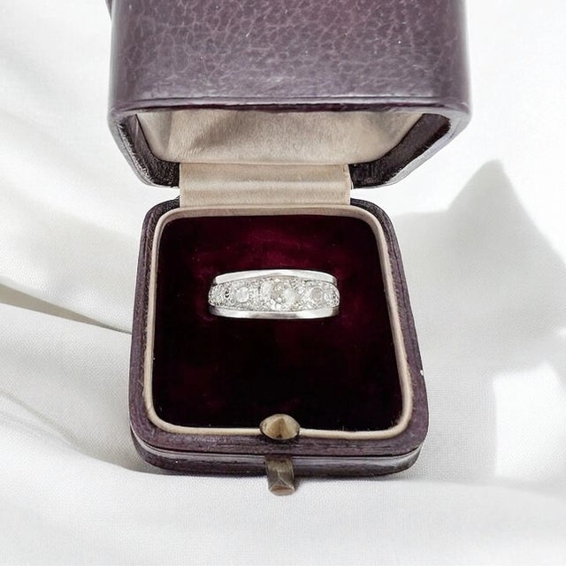 Rare Art Deco eternity wedding band (circa 1930) in platinum. It is decorated with old cut diamonds in fall totaling...