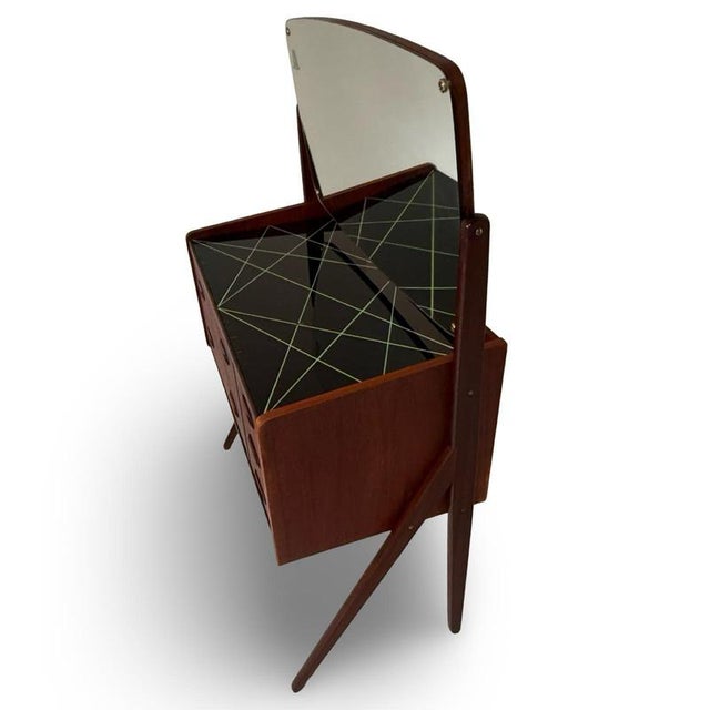 Danish made secretary desk / dressoir with vanity mirror. Black glass work station under the mirror and multiple drawers...