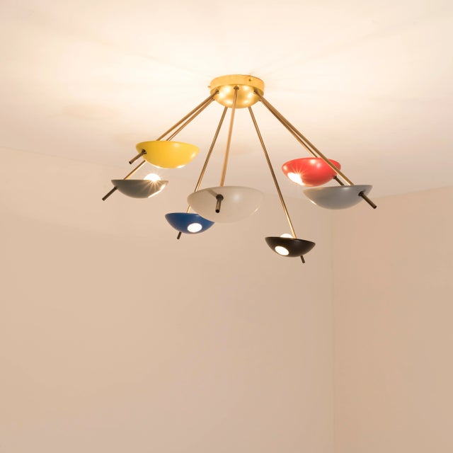 The Helios Septem I Ceiling Light brings elegance to midcentury design through the inspiration of Italian design -...