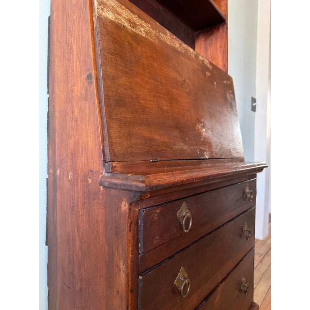19th century early American hand made wibbly primitive secretary with drop down slant front. Upper shelves with scalloped...