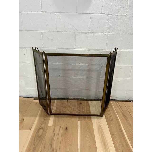 3 panel Brass Fire Screen with mesh inserts. Classic early design with flat brass frame. Securing rods topped off with...