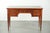 Elegant English-style desk with a green leather top featuring beautiful gold-colored details and five drawers. : This...