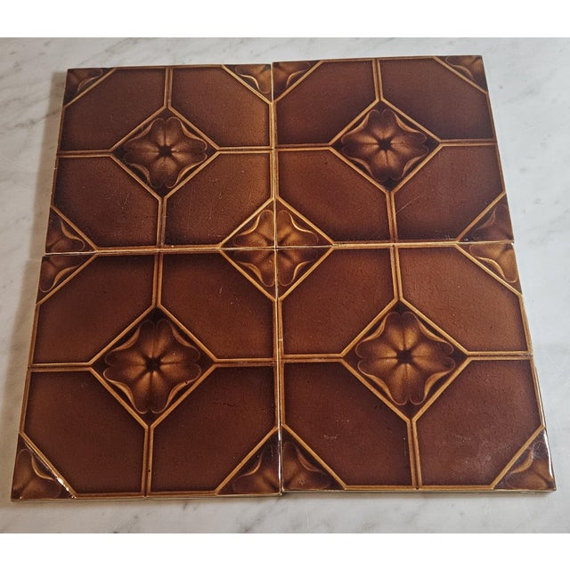 This set of four Art Deco tiles by the English Pilkington Tile and Pottery Company features a bright, glossy glaze and a...