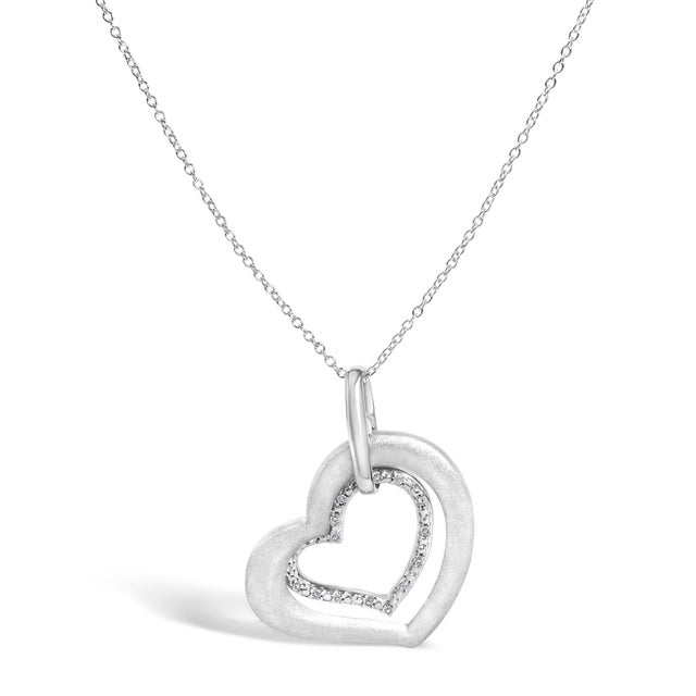 Indulge in the muted elegance of this exquisite heart pendant necklace, meticulously crafted in .925 sterling silver with...