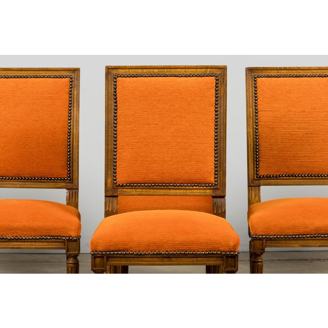 Sourced in Provence, France, this set of mid-20th-century dining chairs is made in the Louis XVI style, with square...