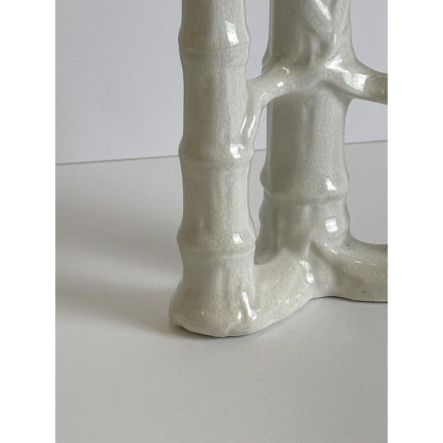 An evocative late Victorian spill vase produced in England circa 1890, distinguished by its sculptural bamboo-inspired...