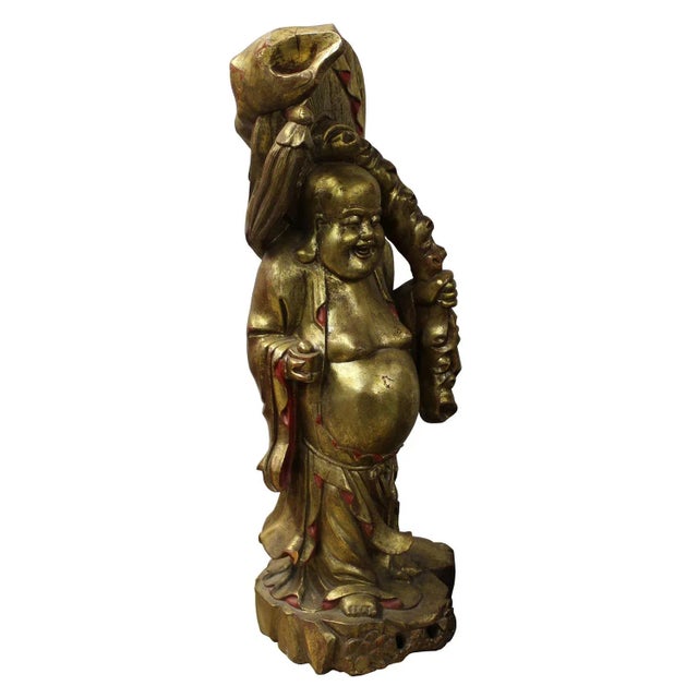 Hand carved detailed Happy Buddha statue, this Buddha statue is carved with solid wood painted gold color with one hand...