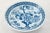 Japanese blue and white ceramic eight inch bowl with a cherry blossom scene encircled by an intricate blue band on the...