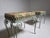 Charming pair of Italian stools dating from the 1950s, featuring decorative wrought iron frames with elegant scrolling...