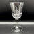 An elegant trio of antique English hand-blown glass wine goblets (20 cm high) featuring a detailed wheel-engraved frieze...