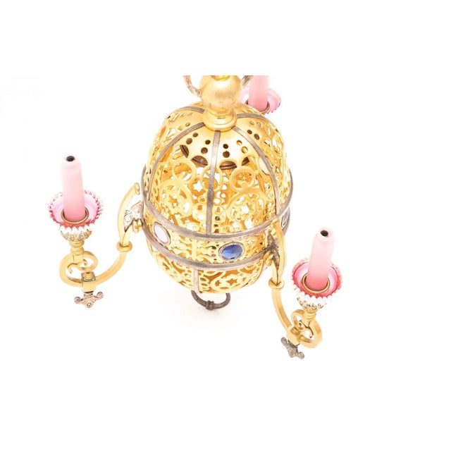 Turkish style gilt hanging lamp with inlaid glass jewels, pink glass candle covers and pink/white glass drip pans....
