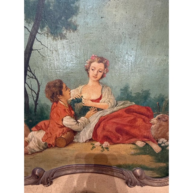 19th century French louis xvi carved and parcel gilt trumeau mirror with a hand painting in the top, Circa 1850. the...