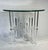 Glamorous 1970’s Mid-Century Modern Lucite columns and glass round side table. This table features chrome accents, a...