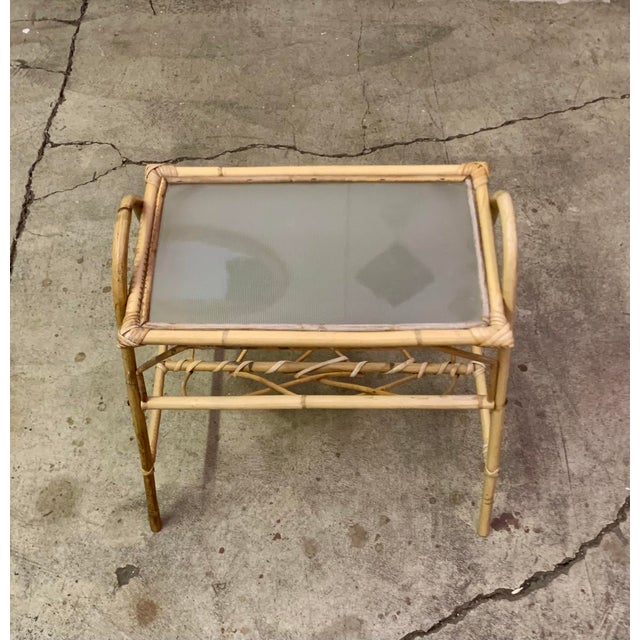 Italian Mid-Century Modern Rattan & Bamboo Side Table with Glass Plate and Magazine Rack, 1950s/60s This exquisite Italian...