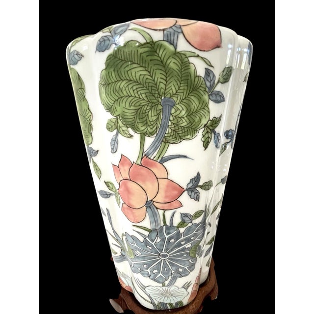 This Vintage Green Pink Lotus Blossom Chinoiserie Lilly Pad Lamp is a large, multicolor table lamp with an Asian design...