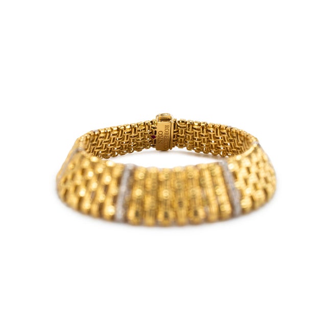 Brand: Roberto Coin Gender: Ladies Metal Type: 18K White & Yellow Gold Length: 7.25 inches Width: 13.00 mm Weight: 38.20...