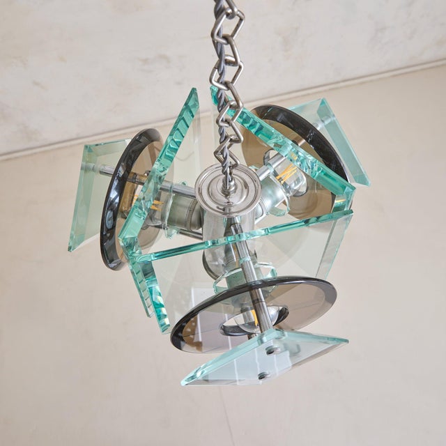 An Italian chandelier designed by Antonio Lupi for Lupi Cristal Luxor, dating to the 1970s. The chandelier is composed of...