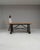This 1900s French industrial table embodies functionality and timeless design. Featuring a solid wood top with a rich,...
