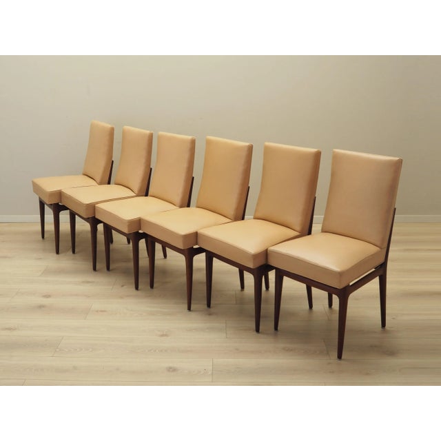 The set of six chairs was made in the 1960s, Italian production. The structure is made of mahogany wood. The wood has been...