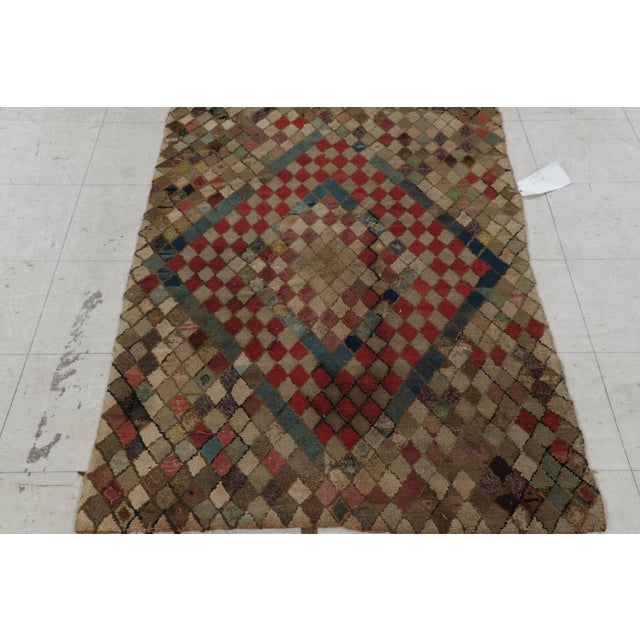 Handmade in wool and originating circa 1920-1930, this 3x5 rug is a rare and exciting new curation in Rug & Kilim’s...