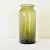 Dimensions: 10 ¾” H x 4 ½” W x 4 ½” D French 18th century olive-green glass pickling jar or kitchen storage jar. The...