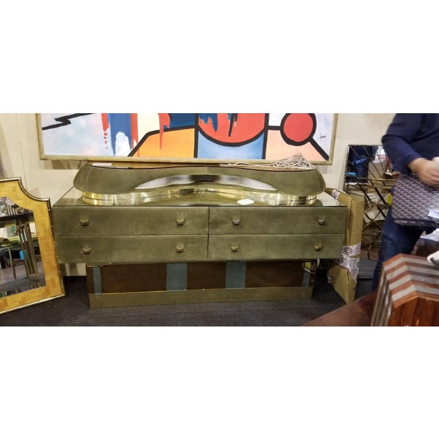 Italian Modern Mirrored Top Lighted Suede Dresser Italian Faux Suede Dresser Origin: Italy Made in Italy, circa 1970’s Has...
