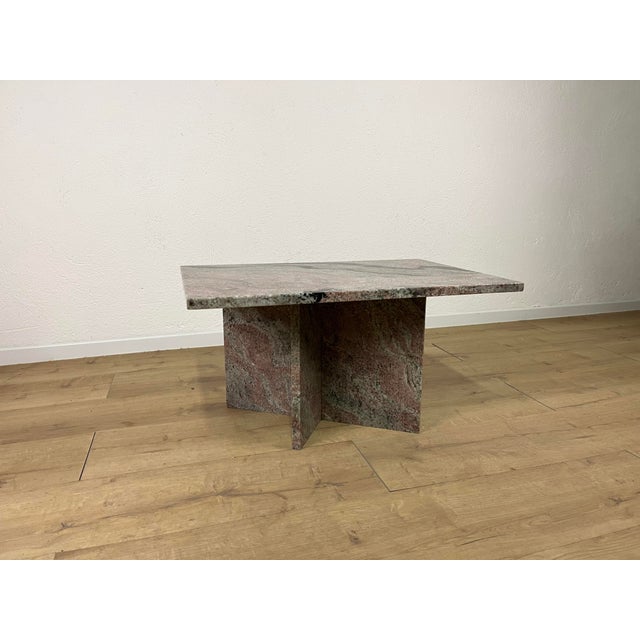 Coffee table with a woven marble base and a rectangular marble top, made in Italy in the 1970s. The table has been...