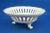 Item description: A stunning three-legged centerpiece, a fruit bowl made of openwork porcelain and entirely decorated by...