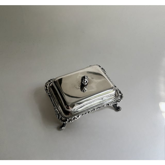 Early 20th Century Seranco EPNS silver-plated covered Butter Dish. Featuring a two piece, squared, rectangular form,...