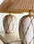 An exceptional pair of vintage Hollywood Regency table lamps featuring the highly sought-after “icing” faux bamboo...