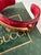 Vintage 1990's Gucci open cuff bracelet in red crocodile style leather with the iconic Gucci gold tone narrow horse bit...