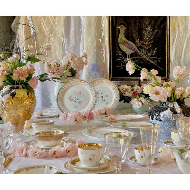 A narrow pink and heavenly border sprayed of black seeds is lapped by a border of graphic grows of palm, thin and thorny....