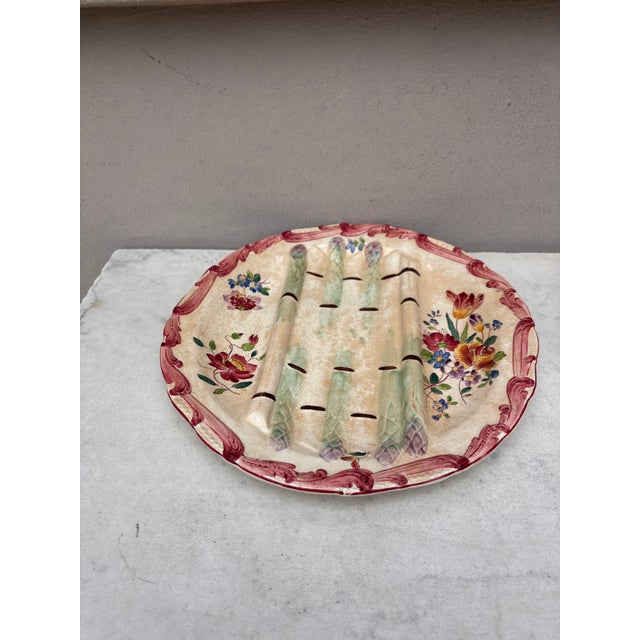 Majolica asparagus plate with flowers , signed Longchamp circa 1890.