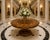 An exceptional and large Irish Killarney marquetry inlaid centre table in beautifully figured yew wood, a striking...