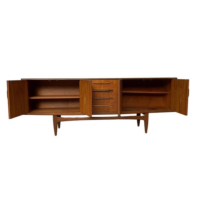 Mid-Century Modern credenza sideboard by G-Plan, circa 1967 in solid teak and afromasia teak on ‘Floating Base,’ with...
