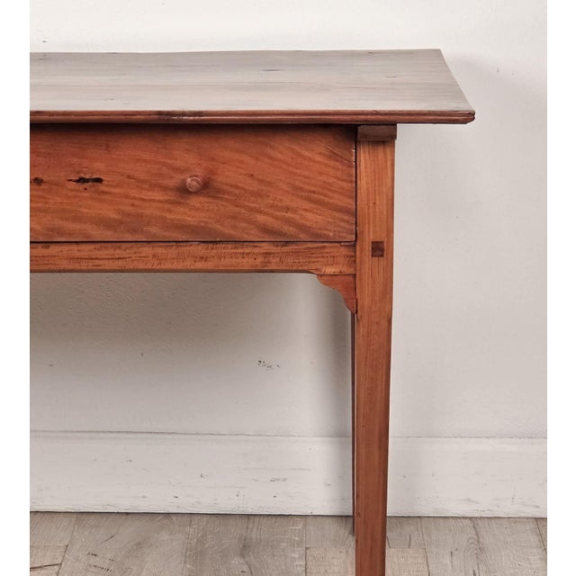 An American fruitwood one-drawer tavern table, circa 1810.