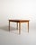 Scandinavian-made dining table in teak and stained beech, with a rectangular top and two 40 cm extendable side extensions....