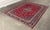 Design Plus Gallery presents a 11ft 4 in × 15ft 6 in Persian Kashan Handmade Wool Rug. This traditional rug displays an...