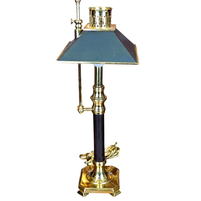 Elegant vintage Chapman bouillotte table lamp with polished brass frame, black accents, and classic black metal tole...