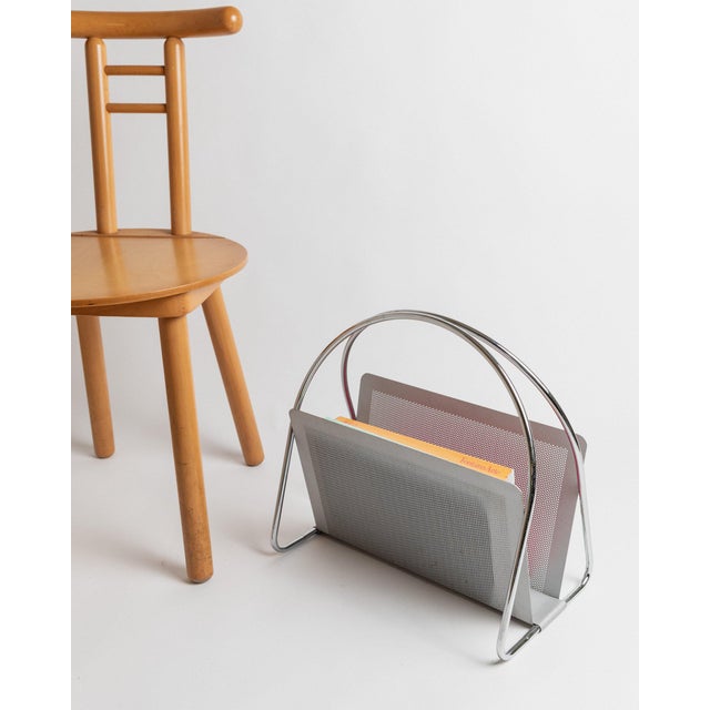 This vintage metal magazine rack by Mascagni from the 1970s impresses with its perforated design in space age style. The...