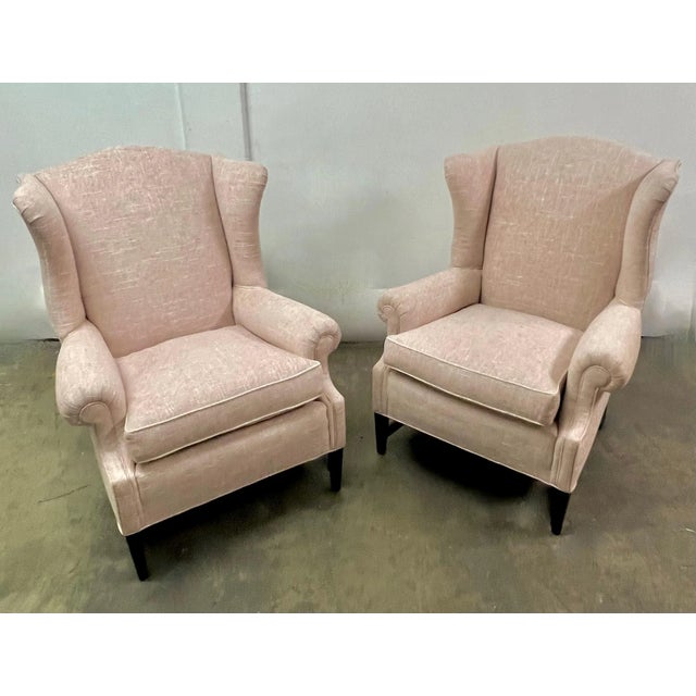 Pair of Wing Back Chairs in the Style of Georgian. Newly upholstered in Linen with a cord welt to the cushions. A...