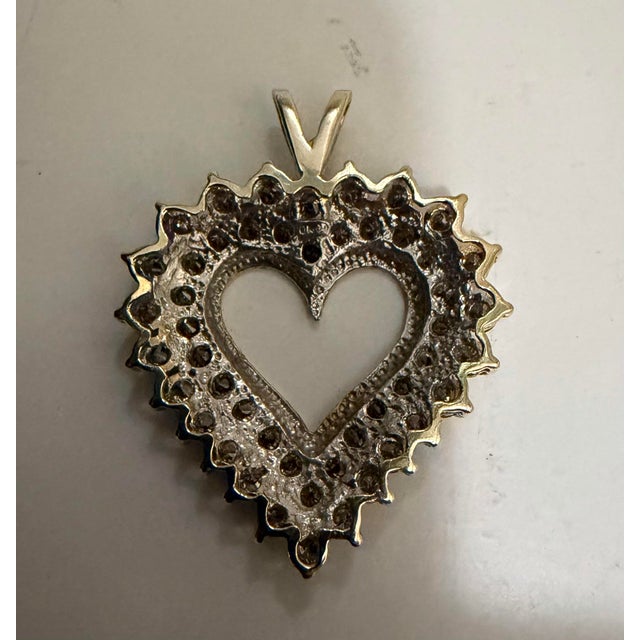 10K Yellow Gold Approx 2.5 CTW VS1 Diamond Heart Pendant Approximately 2.5 carats of diamonds about 46 Natural VS one VS...