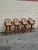 Set of four vintage rattan swivel bar stools with rounded fan-back form and open radial splat detail. Bent rattan frame...