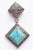 Pave` set diamonds adorn the post of these drop earrings and also border the beveled square turquoise stones set on the...