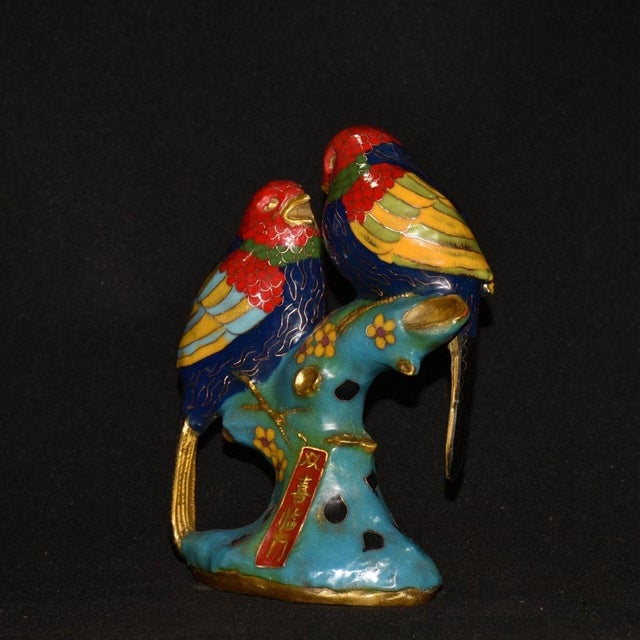 This charming vintage cloisonne enamel figurine features a pair of lovebirds perched together on a sculpted branch. Each...