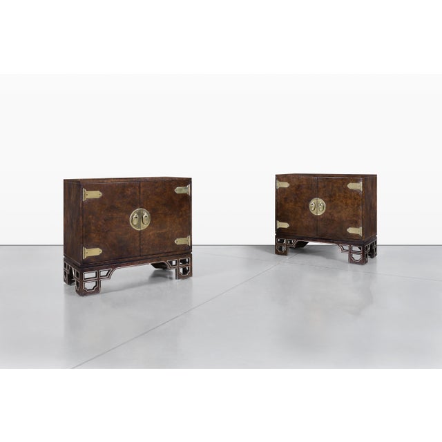 Discover the timeless elegance of these vintage burl wood cabinets by Mastercraft, a true testament to American...