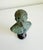 A small-scale, Italian Grand Tour museum reproduction bronze bust of Julius Caesar mounted on a polished black marble...