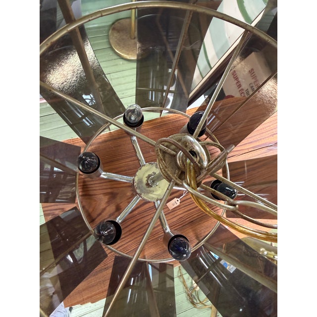 Bring authentic space-age drama to your interior with this striking Mid-Century Modern pendant chandelier. The fixture...