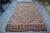 A Turkish vintage handwoven Kilim rug from Anatolia made of wool on wool and in good condition.